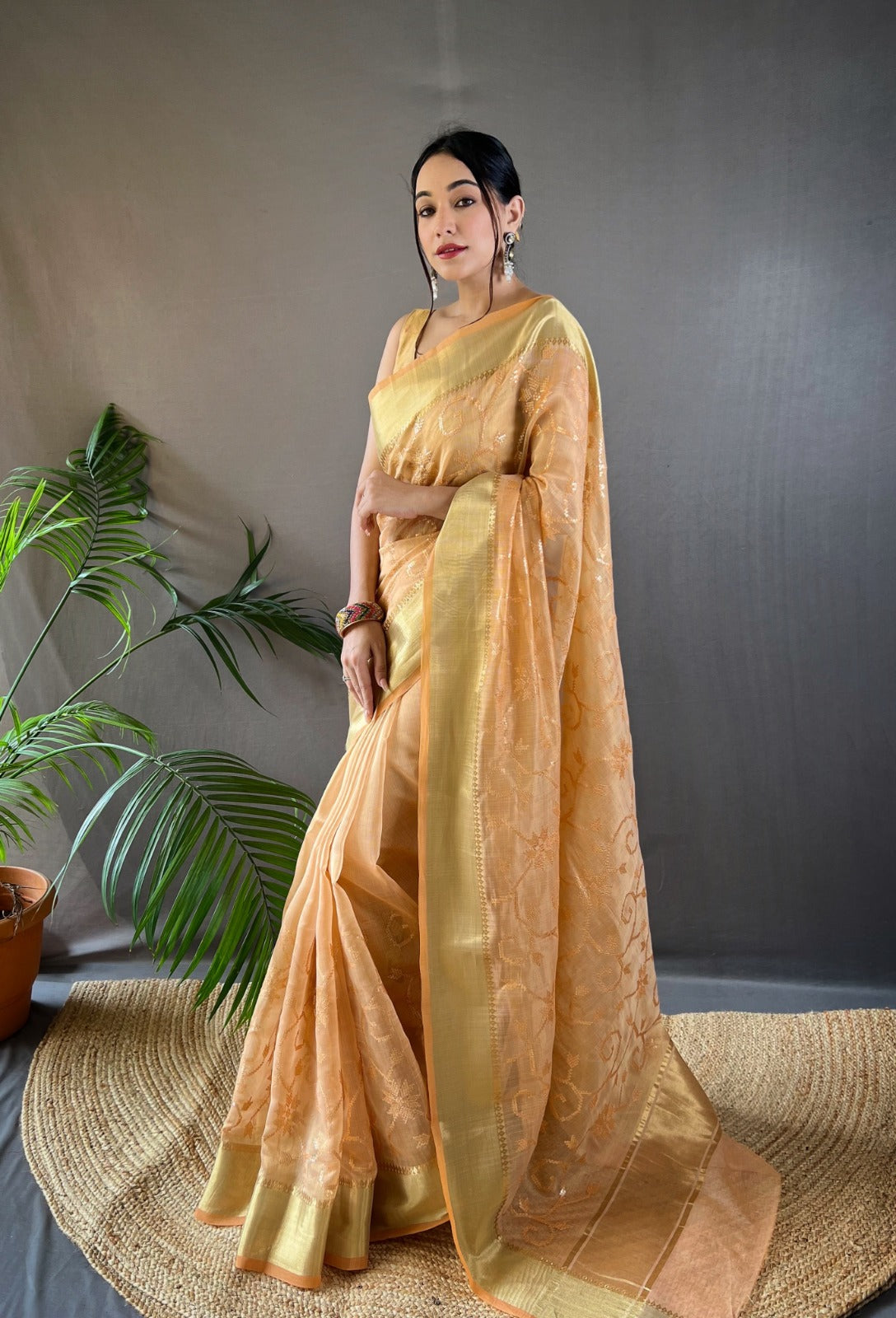 Soft Tissue Saree With Golden Weaving Border and Sequence Embroidery